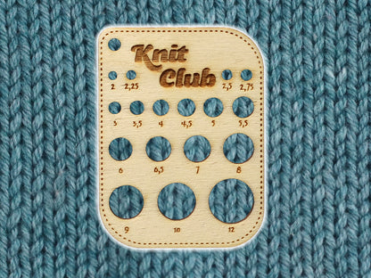 wooden needle size gauge for easy identification of knitting needle sizes from 2mm to 12mm.